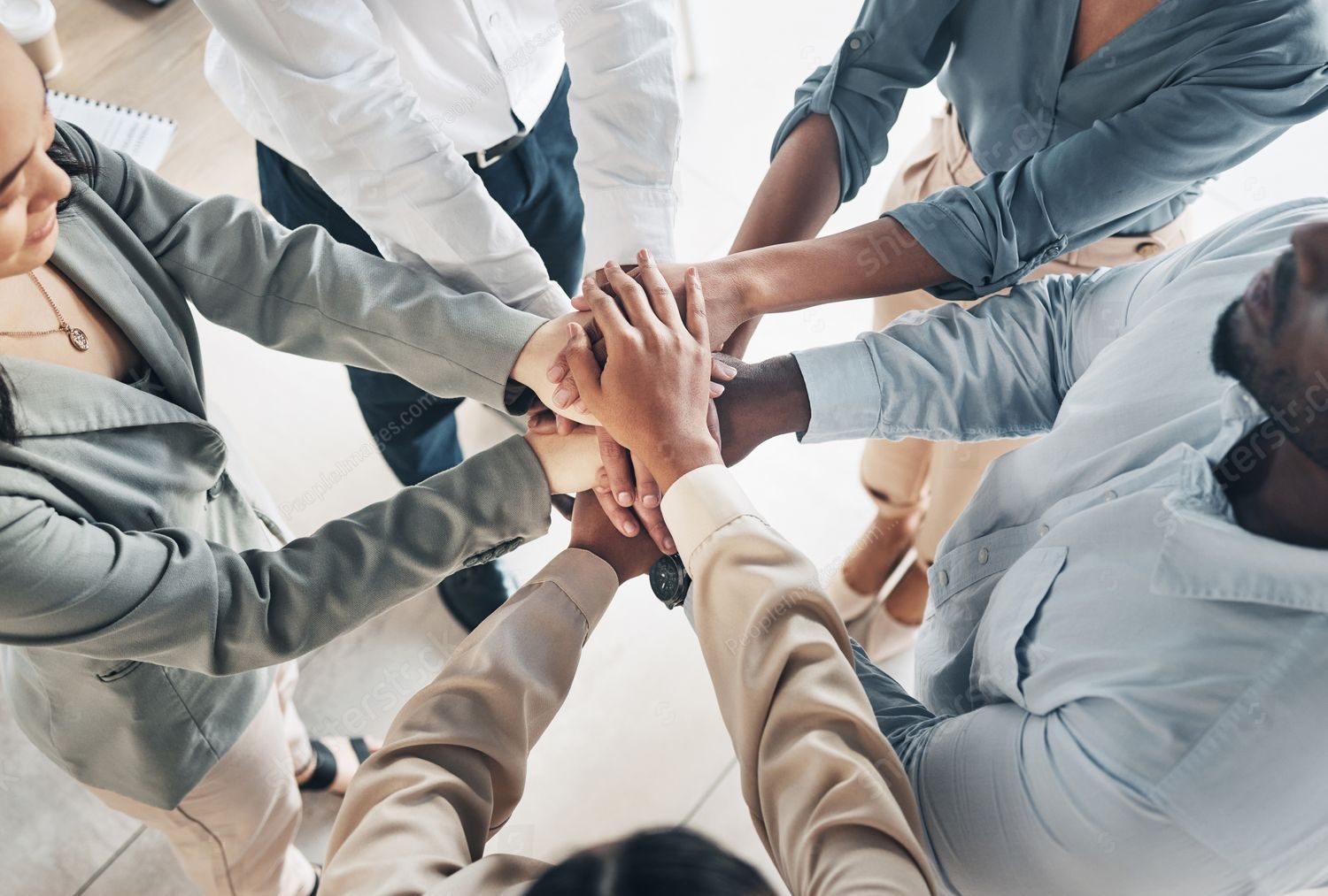 Team shaking hands or real estate handshake